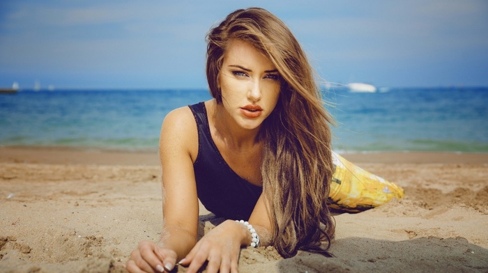 lying on front, girl, beach, brunette, model, black clothing, gray eyes, sea