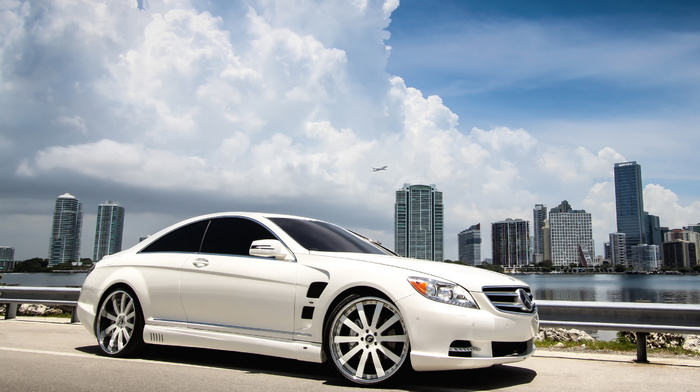 airplane, white, clouds, wheels, cars, city, bay