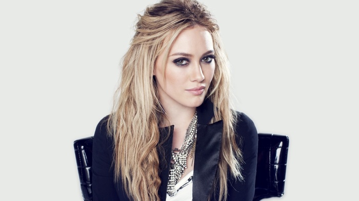 blonde, jacket, simple background, Hilary Duff, sitting, girl, hazel eyes