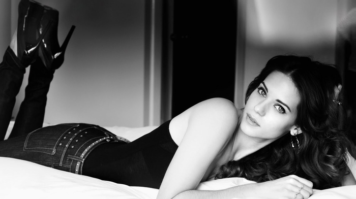 wavy hair, girl, girl indoors, lying down, brunette, Lyndsy Fonseca, monochrome, open mouth, looking at viewer, heels