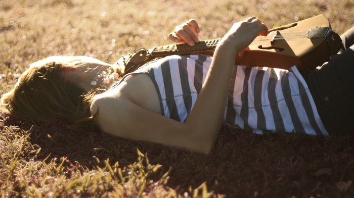 striped clothing, sunlight, musical instrument, lying down, girl