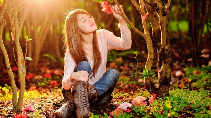 sitting, boots, trees, model, smiling, Asian, nature, jeans, forest, sunlight, long hair, flowers, closed eyes, girl outdoors, brunette, girl