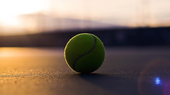 tennis balls, sunlight, blurred, lens flare, depth of field