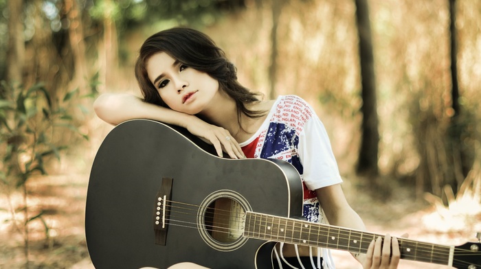 model, T, shirt, Asian, guitar, looking at viewer, forest, girl, long hair, legs, trees, girl outdoors, leaves, nature, brunette, musicians, sitting
