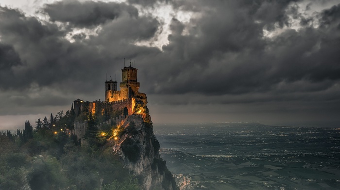 clouds, hill, dark, castle, cityscape, tower, rock, trees, lights, field, nature, landscape, architecture, San Marino