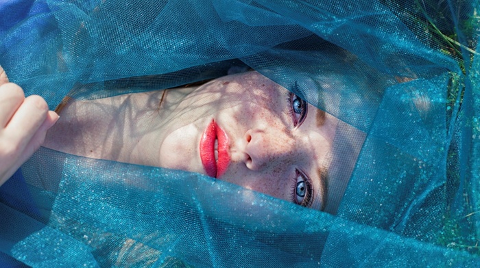 lying on back, blue eyes, lying down, freckles, looking at viewer, girl, red lipstick, face