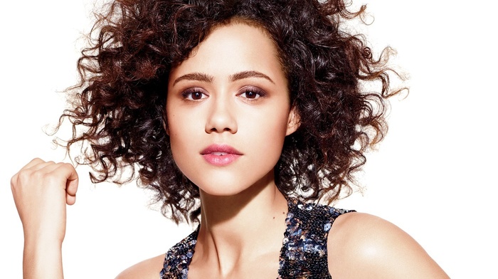 Nathalie Emmanuel, brunette, open mouth, looking at viewer, simple background, actress, portrait, bare shoulders, model, girl, brown eyes, curly hair, face