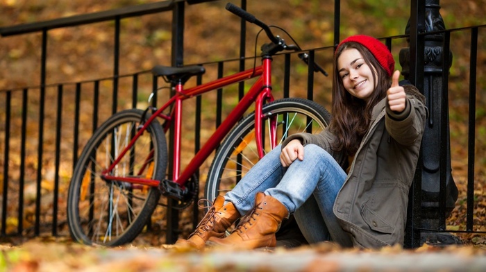 jeans, bicycle, model, boots, sitting, girl outdoors, coats, long hair, fence, brunette, leaves, smiling, fall, girl