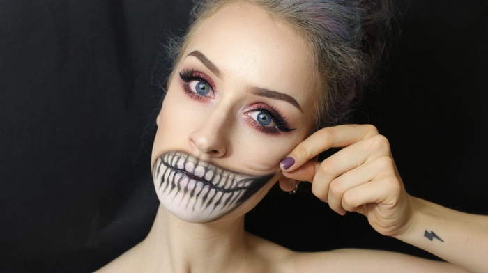 body paint, long hair, Halloween, portrait, model, tattoo, blonde, makeup, girl, face, black background, looking at viewer, teeth, blue eyes