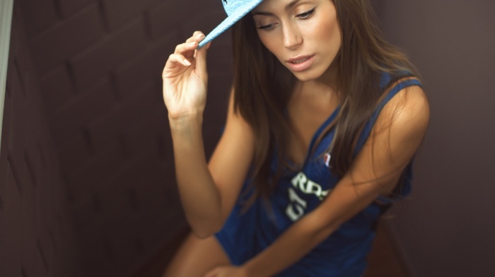 girl, walls, sitting, baseball caps