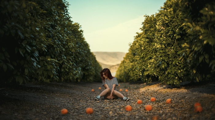 mangos, orange fruit, sitting, girl, redhead
