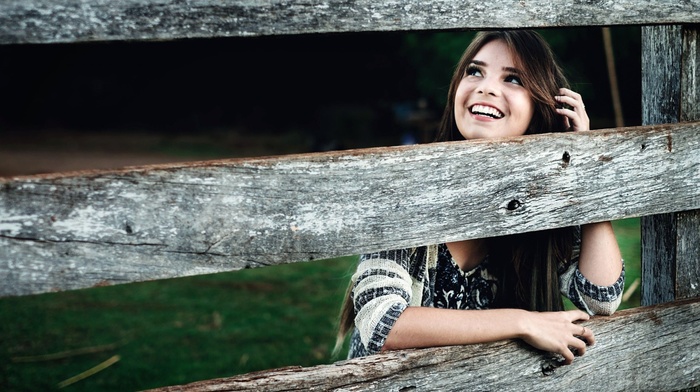 sweater, teeth, girl outdoors, fence, long hair, wood, smiling, model, girl, face, brunette, looking up