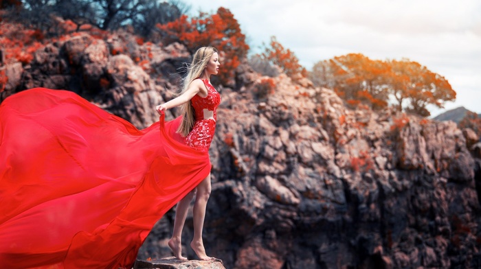open mouth, trees, red dress, windy, nature, long hair, model, girl outdoors, barefoot, girl, blonde, rock