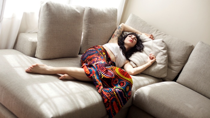 brunette, tattoo, painted nails, black nails, skirt, looking up, girl, curly hair, couch, lying down