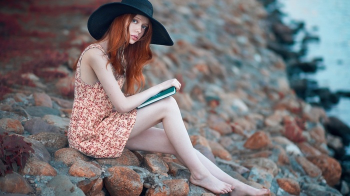 looking at viewer, rock, model, sitting, redhead, girl