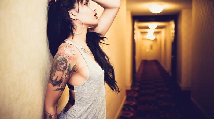 hallway, piercing, pierced nose, hands in hair, tattoo, hands on head, long hair, tank top, girl, red lipstick, brunette, arms up