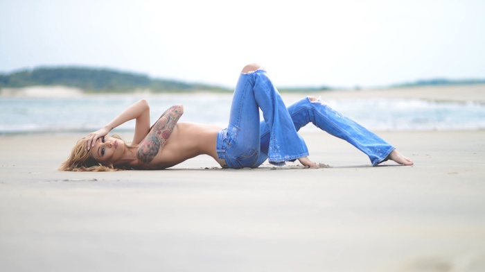 on the floor, sand, tattoo, model, topless, girl, Lisa Marie, strategic covering, jeans, holding boobs