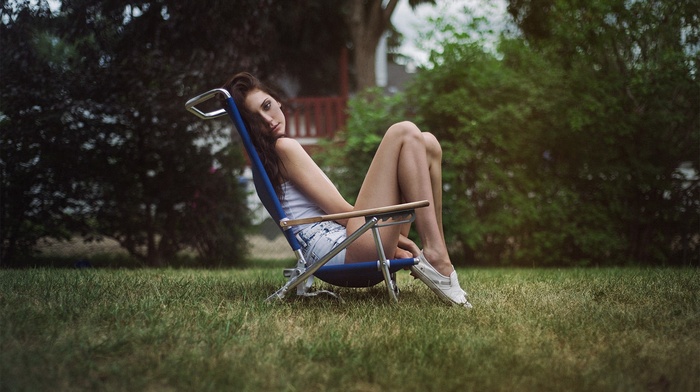 model, girl, sitting, chair, grass, jean shorts