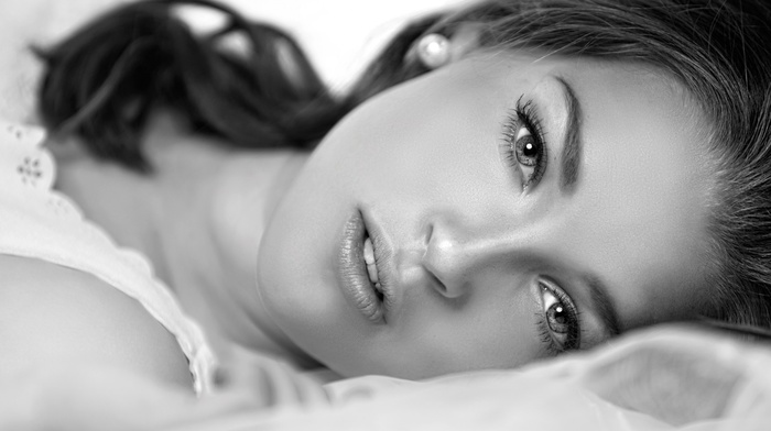 depth of field, face, model, girl, white clothing, brunette, looking at viewer, lying on back, monochrome, long hair, open mouth