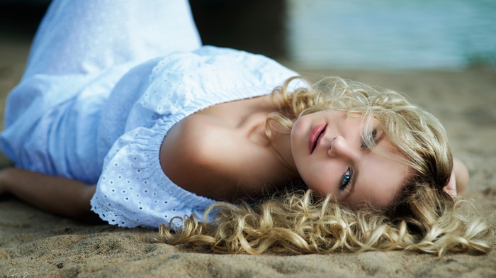 sand, curly hair, white dress, dress, beach, lying down, girl, blonde, blue eyes, girl outdoors