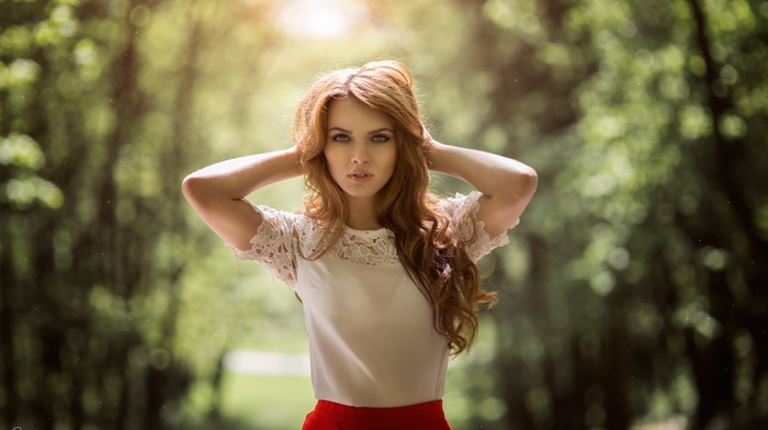 redhead, long hair, forest, looking at viewer, girl outdoors, girl, open mouth, hands in hair, sunlight, blue eyes, depth of field