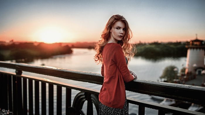 sunset, girl, long hair, dress, lighthouse, open sweater, river, bridge, redhead, depth of field, sweater, Georgiy Chernyadyev