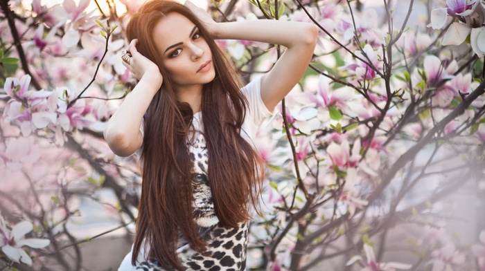 girl outdoors, sunlight, girl, trees, brown eyes, looking at viewer, hands in hair, cherry blossom, brunette, straight hair, long hair