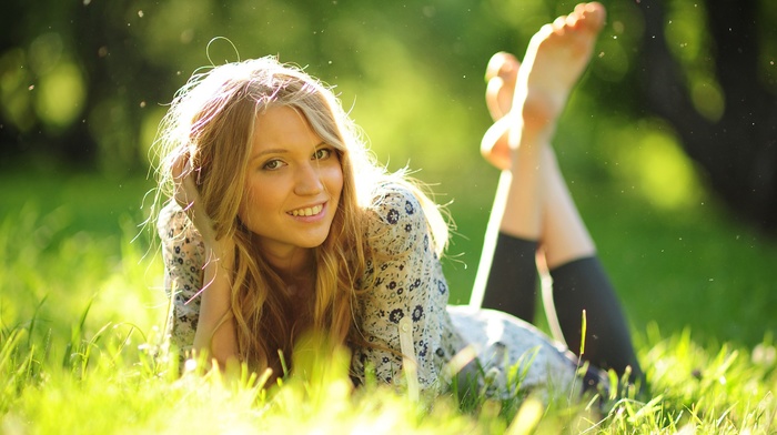 blonde, grass, looking at viewer, depth of field, girl, lying on front, smiling