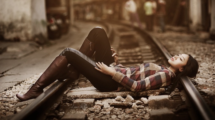 model, shirt, girl outdoors, brunette, urban, girl, Asian, closed eyes, depth of field, people, long hair, railway, tights, stones, street, lying on back, knee, high boots, open mouth