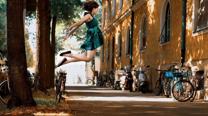 jumping, bicycle, girl, brunette, street, lights, trees