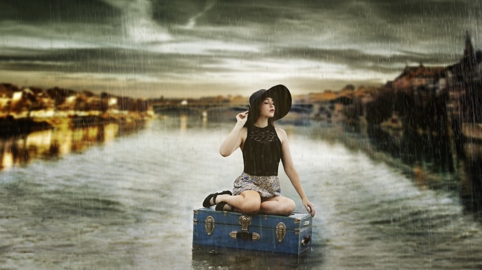 closed eyes, cityscape, water, sitting, girl, open mouth, suitcases, lights, skirt, hat, clouds, brunette, bare shoulders, reflection, long hair, black clothing, girl outdoors, model, river, rain, building