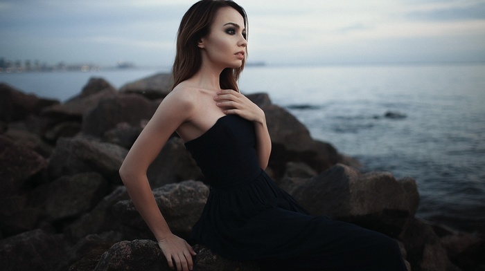 girl, sea, sitting, rock, black dress, looking away