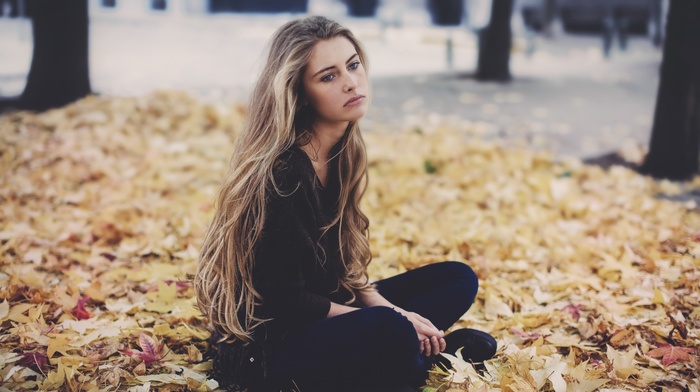 girl outdoors, blonde, looking away, sitting, girl, black clothing