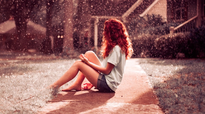 splashes, redhead, long hair, barefoot, T, shirt, jean shorts, model, sitting, girl, open mouth, girl outdoors, street, curly hair, house, water drops, grass, path, bokeh