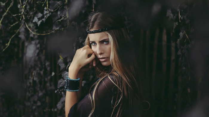 blonde, headband, model, fence, leaves, long hair, girl outdoors, black tops, blue eyes, blurred, portrait, face, looking at viewer, plants, girl