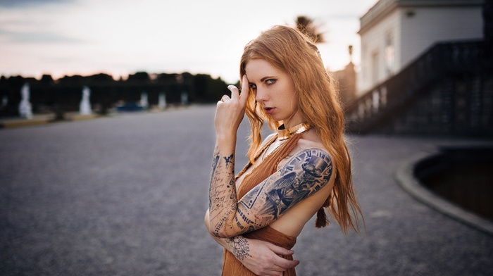 piercing, building, tattoo, blue eyes, open mouth, girl outdoors, looking at viewer, bare shoulders, girl, redhead, model, street, long hair, blonde, portrait, Julia Wendt, depth of field, sunset, river