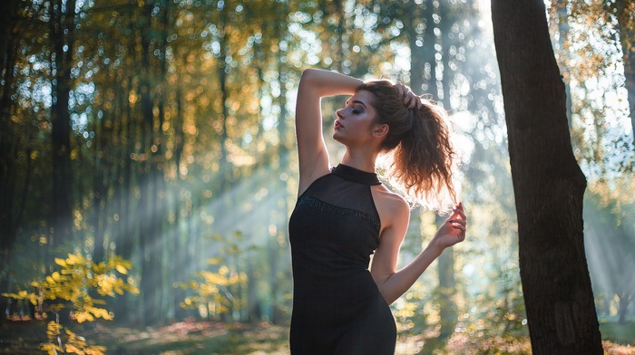 black dress, closed eyes, girl outdoors, sun rays, girl