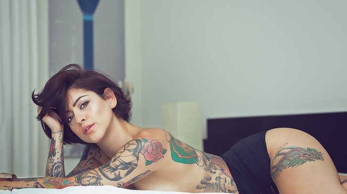 in bed, topless, looking at viewer, tattoo, girl