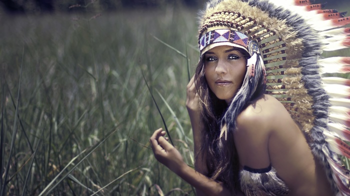 grass, field, girl, face, brunette, bare shoulders, topless, long hair, nature, Native American clothing, feathers, looking at viewer, girl outdoors, headband