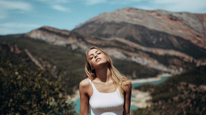 mountain, white tops, long hair, closed eyes, girl, trees, portrait, blonde, model, depth of field, open mouth, bare shoulders, clouds, tank top, river, nature, girl outdoors, face