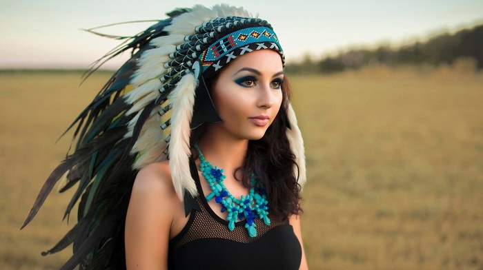 headband, long hair, depth of field, Native American clothing, feathers, makeup, model, girl, looking away, field, face, black dress, brown eyes, brunette, girl outdoors