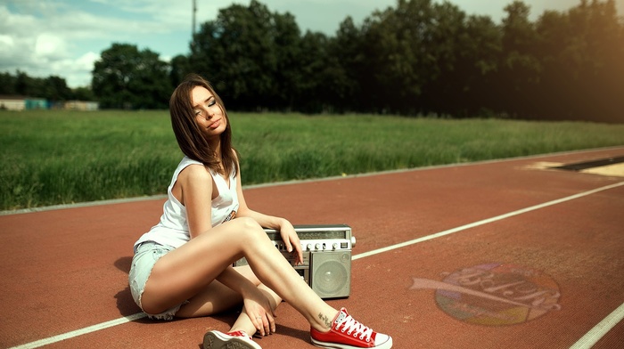 sitting, girl with glasses, ass, girl, closed, jean shorts, smiling, T, shirt, tattoo, sneakers
