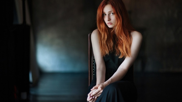 Vladislava Masko, depth of field, redhead, chair, looking at viewer, long hair, model, black dress, bare shoulders, girl, sitting