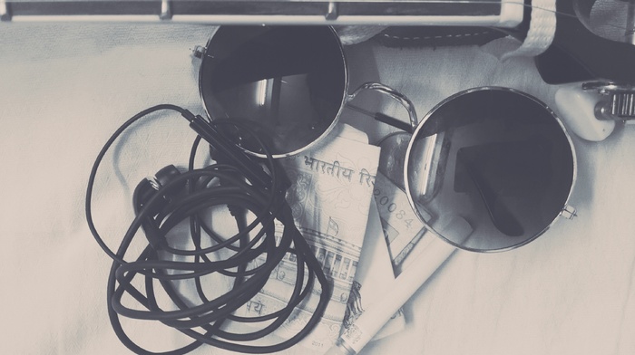 cigarettes, headphones, glasses, guitar, money