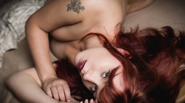 redhead, tattoo, cleavage, sideboob, brunette, girl, lying on side, green eyes, nude