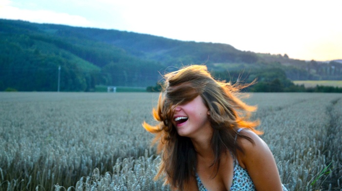 field, smiling, hair in face, girl