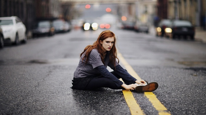 road, depth of field, girl outdoors, sitting, redhead, bokeh, sweater, city