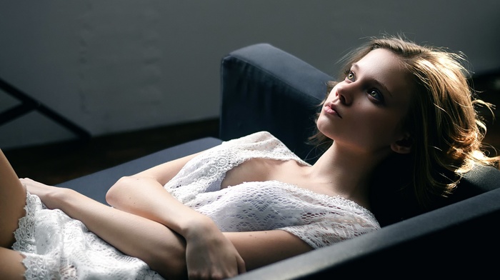 eyes, model, girl indoors, long hair, lying on back, looking away, couch, blonde, girl, cleavage, dress, white dress, lying down, face
