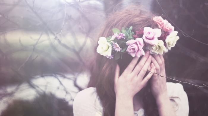 girl outdoors, flower in hair, brunette, covering face, girl