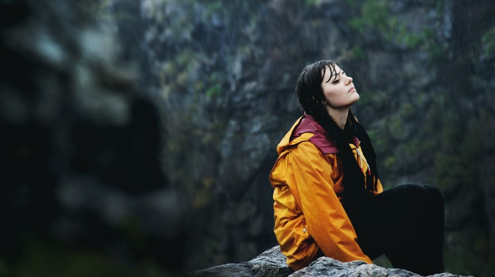 orange jacket, introvert, wet hair, closed eyes, girl, sitting, girl outdoors